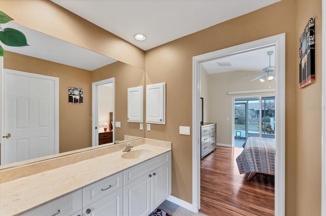 bathroom with ceiling fan, hardwood / wood-style floors, and vanity