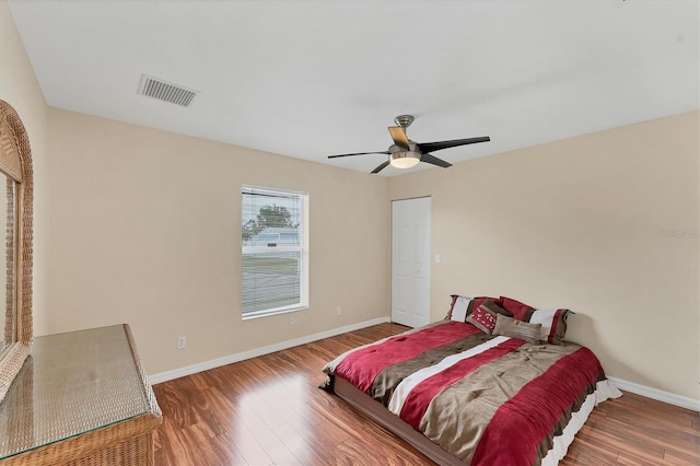 bedroom featuring wood-type flooring and ceiling fan