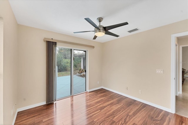 spare room featuring ceiling fan and hardwood / wood-style flooring