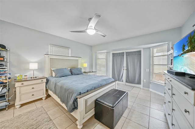 tiled bedroom featuring ceiling fan