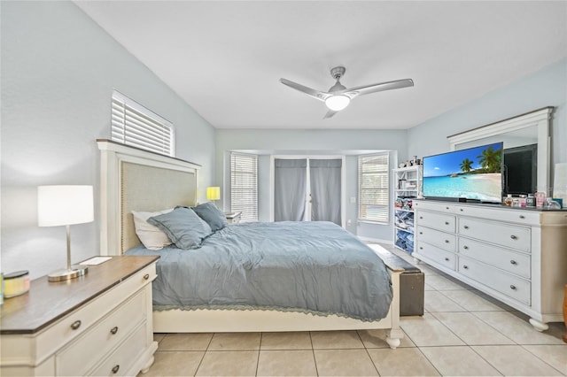 tiled bedroom featuring ceiling fan