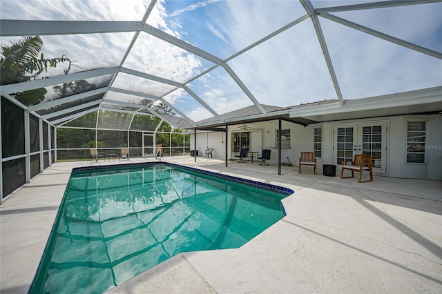 view of pool featuring a lanai, french doors, and a patio area