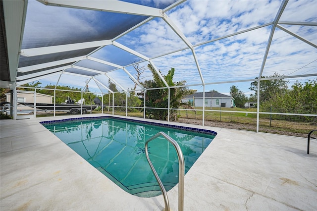 view of pool featuring a lanai and a patio