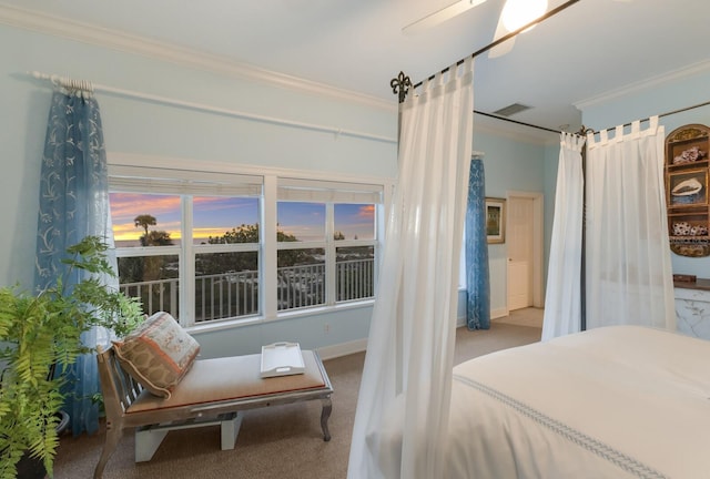 bedroom with ceiling fan, ornamental molding, and carpet flooring