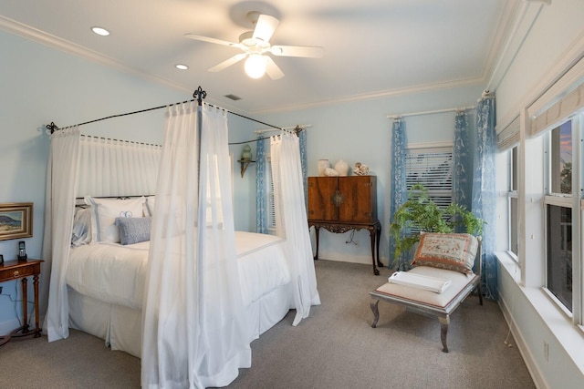 carpeted bedroom featuring ceiling fan and crown molding