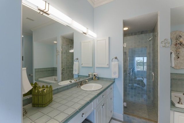 bathroom featuring tile patterned floors, vanity, crown molding, and plus walk in shower