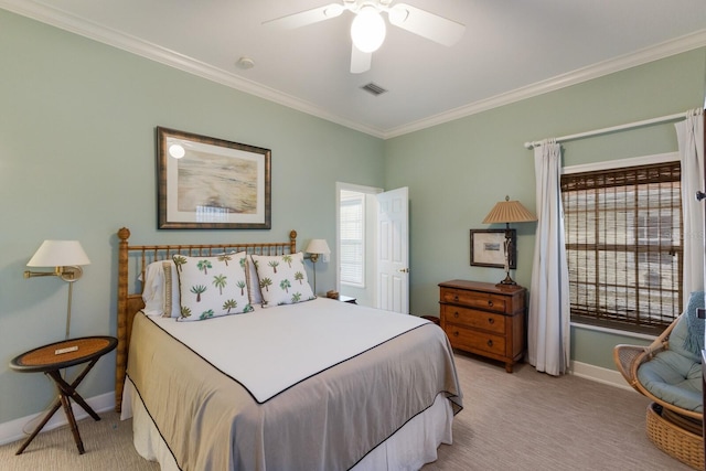 carpeted bedroom featuring ceiling fan and ornamental molding