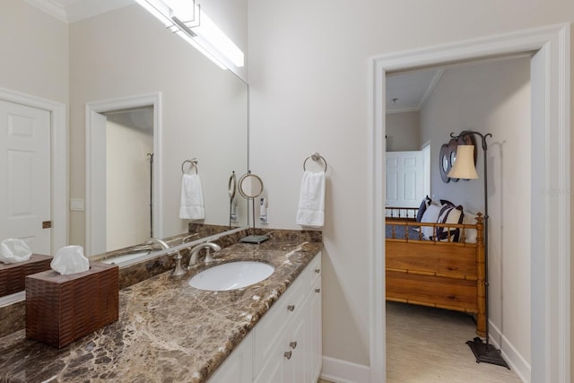 bathroom featuring vanity and ornamental molding