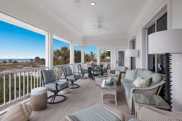 sunroom featuring ceiling fan