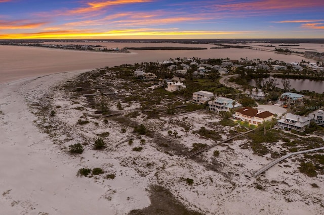 aerial view at dusk with a water view