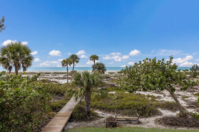 exterior space featuring a water view and a view of the beach