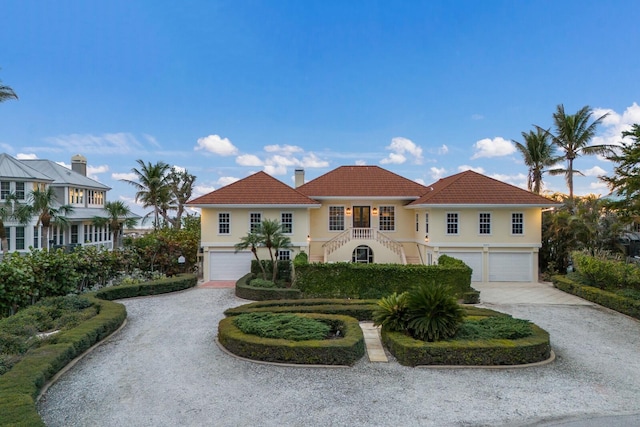 mediterranean / spanish-style home featuring a garage