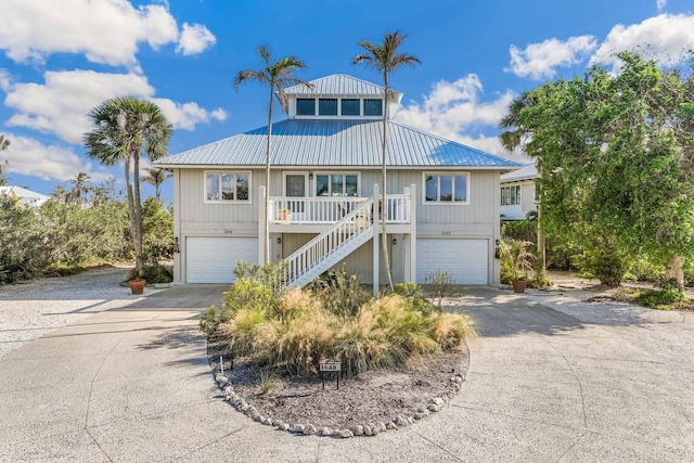 raised beach house with a garage