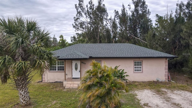 view of front of property with a front lawn