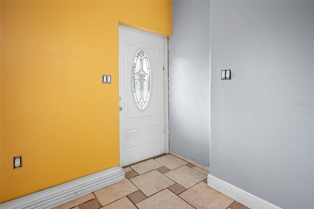 foyer featuring light tile patterned floors