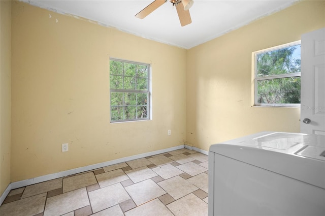 laundry room featuring ceiling fan and washer / dryer