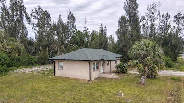 view of outbuilding with a yard