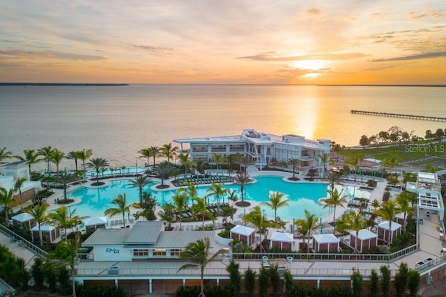 aerial view at dusk with a water view