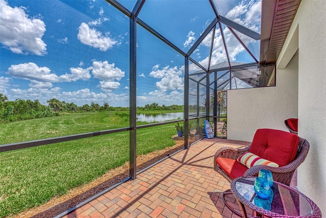 unfurnished sunroom with a water view