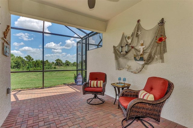 sunroom / solarium with ceiling fan