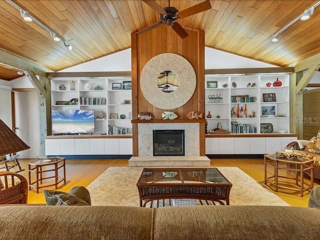 living room featuring light wood-type flooring, a high end fireplace, wood ceiling, and vaulted ceiling