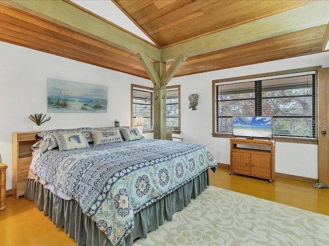 bedroom featuring wood ceiling, vaulted ceiling, and hardwood / wood-style floors