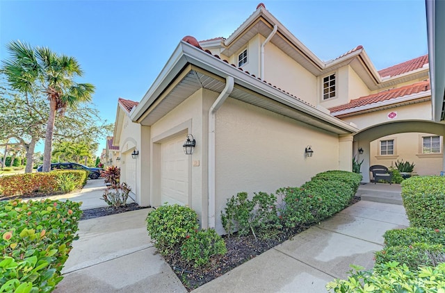 view of property exterior with a garage