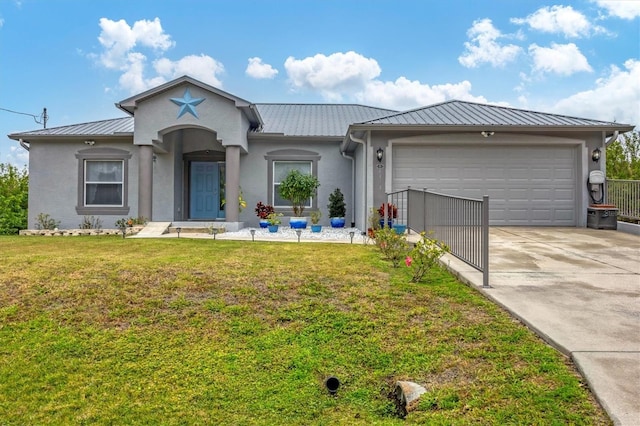 view of front of house featuring a garage and a front lawn