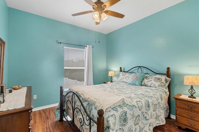 bedroom with dark hardwood / wood-style floors and ceiling fan