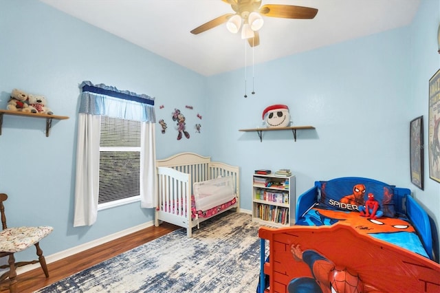 bedroom featuring hardwood / wood-style flooring and ceiling fan