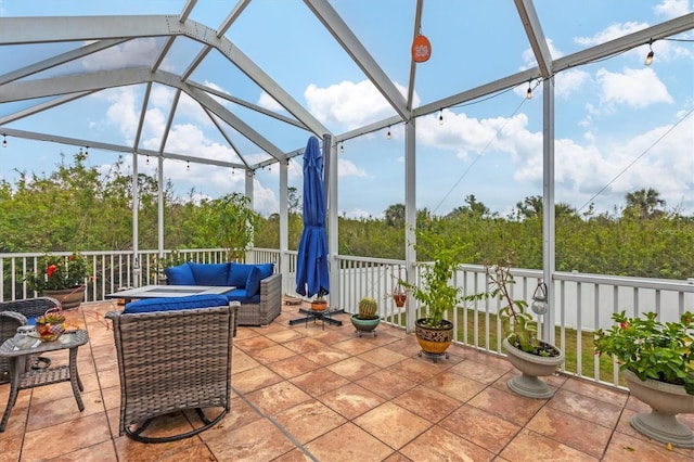 exterior space with an outdoor hangout area and glass enclosure