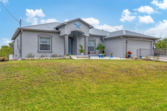 view of front of home featuring a garage and a front lawn