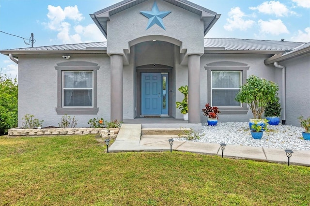 property entrance with a yard