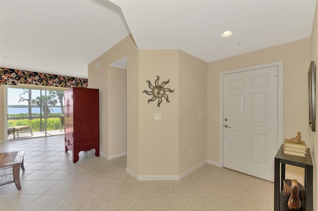 foyer entrance featuring light tile patterned floors