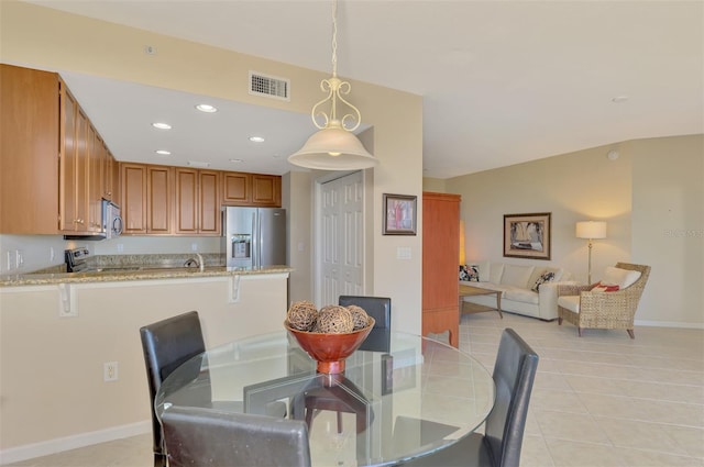 tiled dining space with sink