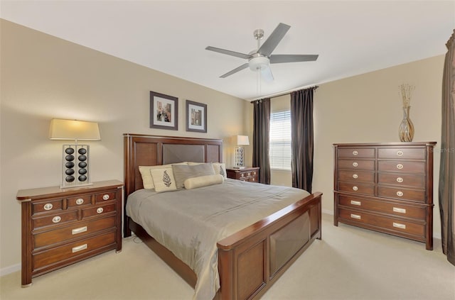 bedroom with light carpet and ceiling fan