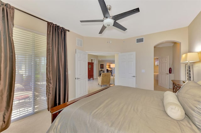 bedroom with light carpet, access to exterior, and ceiling fan