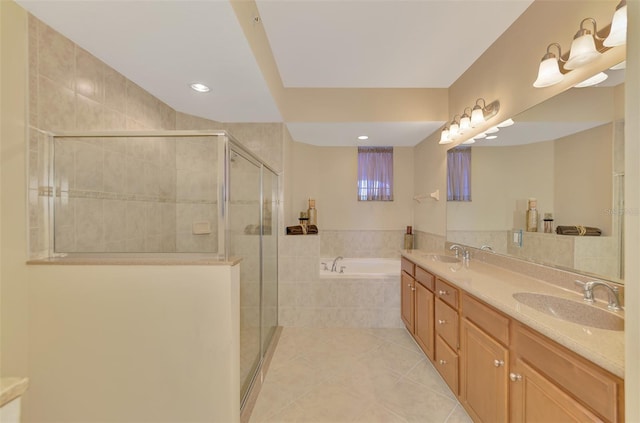 bathroom featuring independent shower and bath, vanity, and tile patterned floors