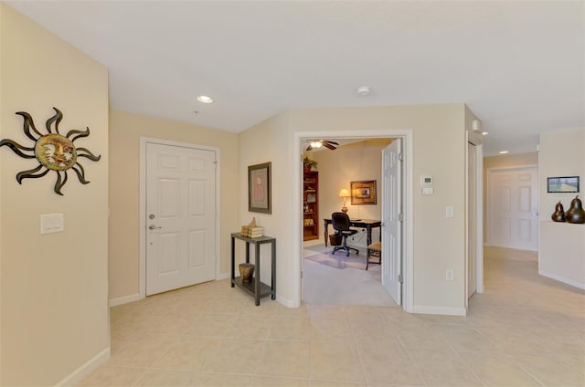 hall featuring light tile patterned flooring