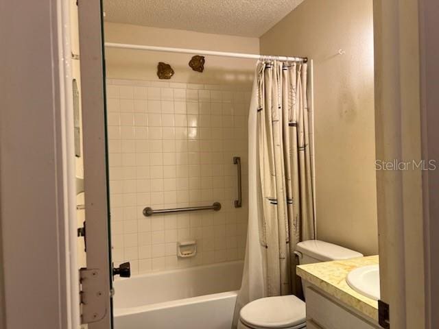 bathroom with toilet, shower / tub combo, a textured ceiling, and vanity