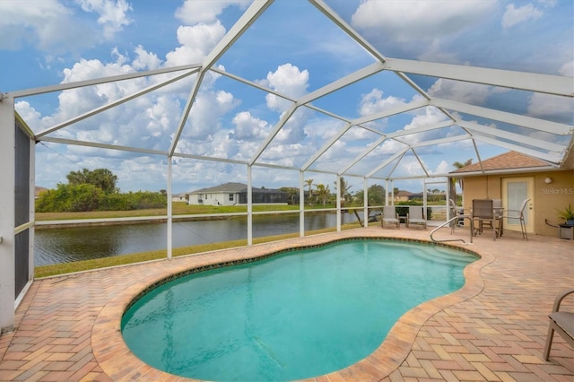 view of pool with a lanai, a water view, and a patio