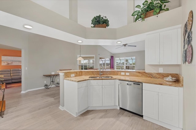 kitchen with white cabinets, dishwasher, kitchen peninsula, and sink