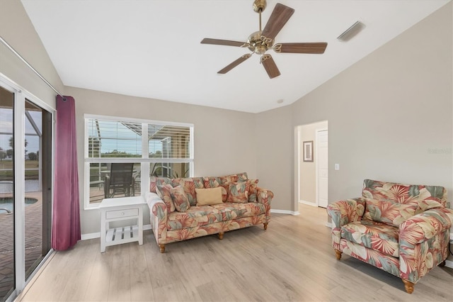 living room featuring ceiling fan and light hardwood / wood-style flooring