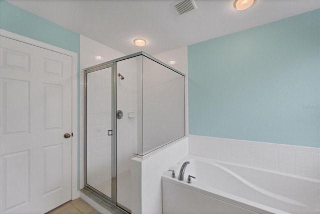 bathroom with tile patterned flooring and plus walk in shower