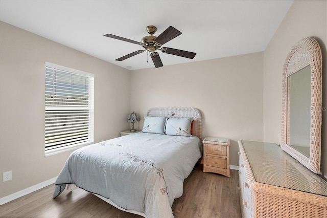 bedroom featuring ceiling fan and hardwood / wood-style floors