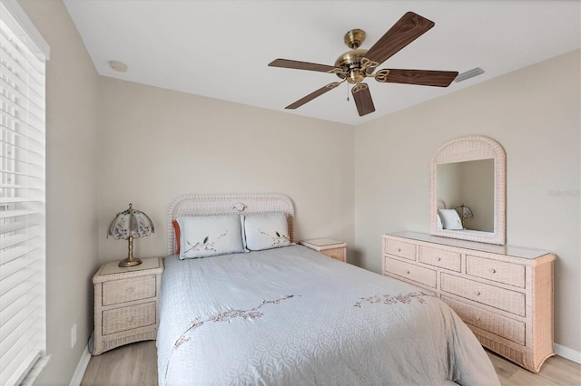 bedroom with light wood-type flooring and ceiling fan