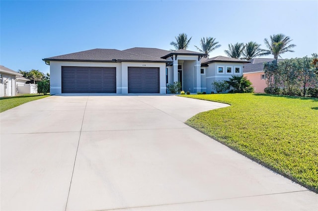 view of front facade with a front lawn and a garage