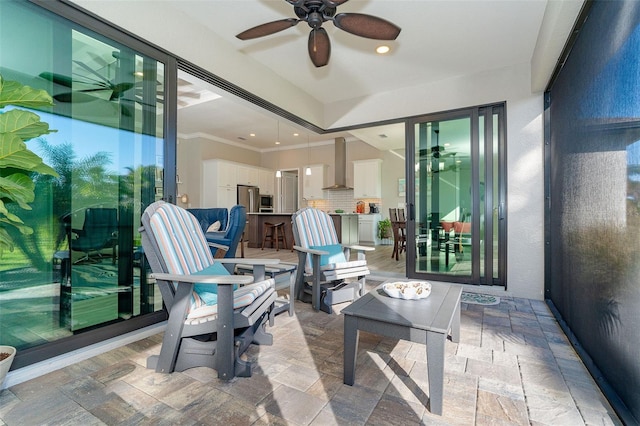 exterior space featuring an outdoor bar and ceiling fan