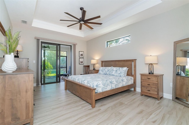 bedroom featuring a raised ceiling, access to exterior, ceiling fan, and crown molding