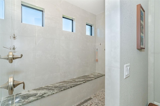 bathroom featuring tiled shower